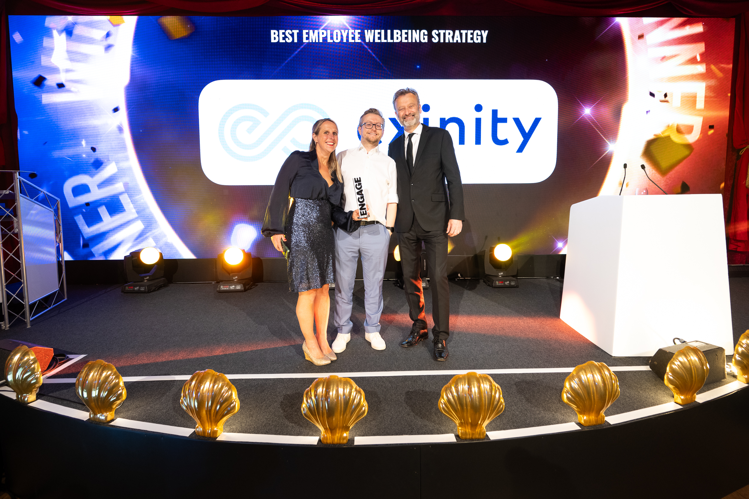 Exinity accepting their Best Employee Wellbeing Strategy award