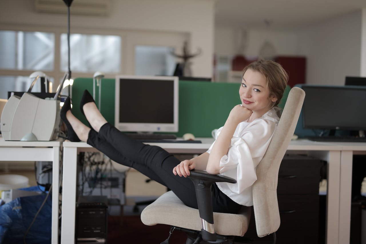 Woman with her legs up on her desk at work