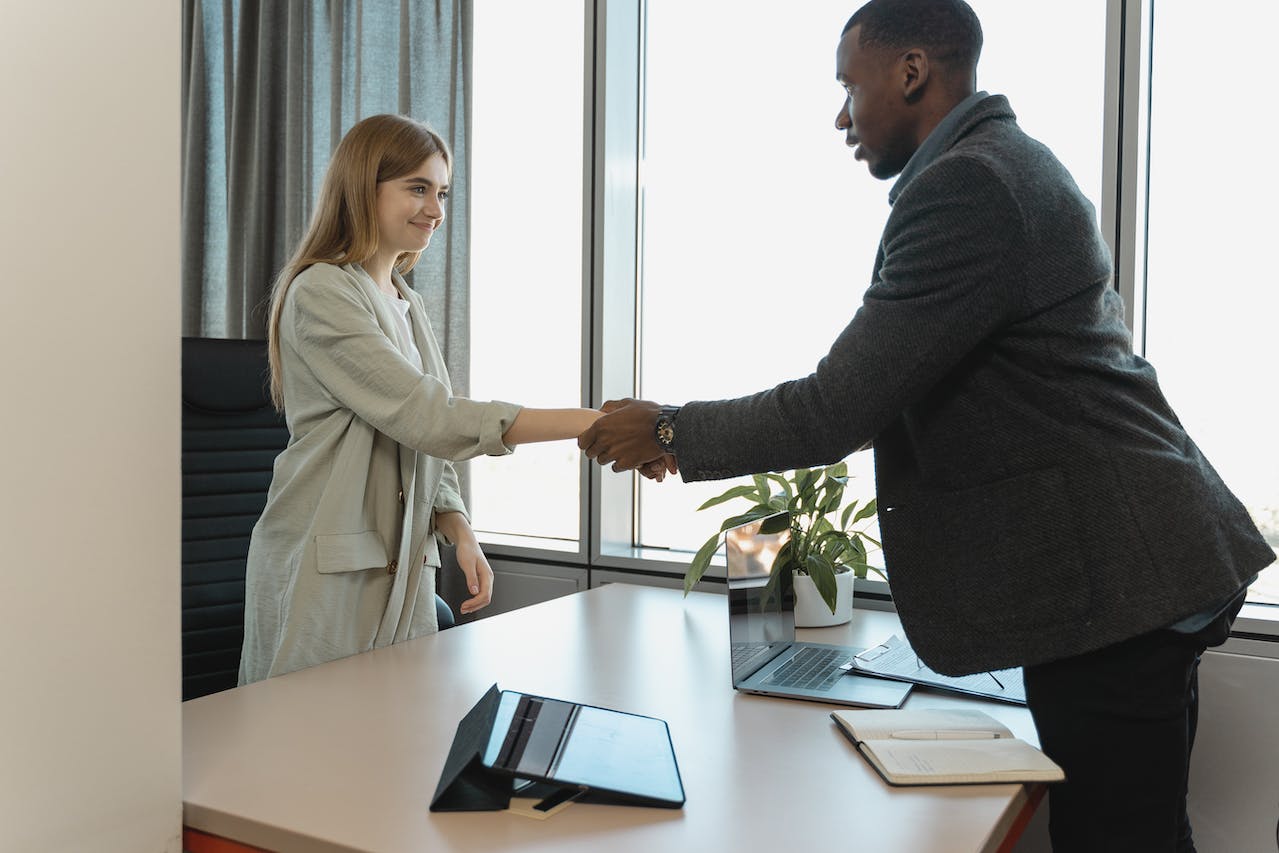 Man and woman shaking hands 