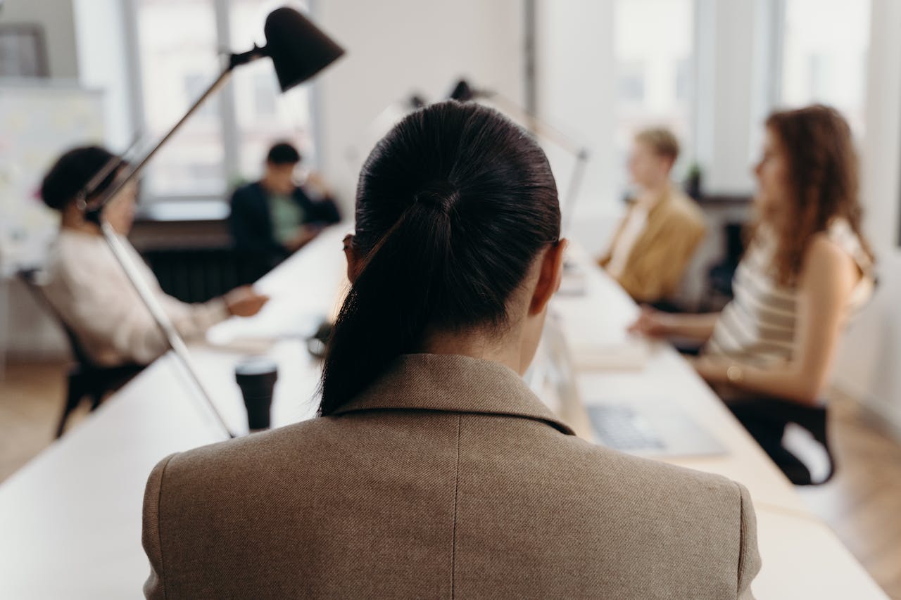 employees sitting at a meeting table