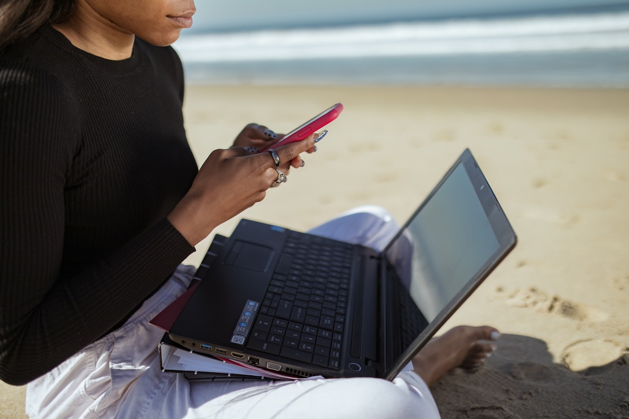 A woman working on a beach